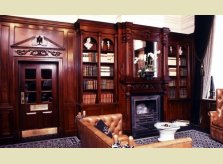 Victorian style sustainable mahogany (sapele) panelled sitting room with bookcases, by Hallidays UK